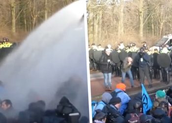 HEFTIGE BEELDEN: Politie zet waterkanon in tegen klimaatactivisten