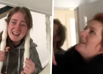 VIDEO: Vastzittende dochter onder trapleuning roept behoorlijk wat vragen op bij vader