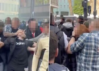 BEELDEN: Hoe de politie onruststokers oppakt tussen de feestelijke Feyenoord-supporters