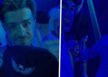 VIDEO: Jack Grealish duikt in volledig Manchester City-tenue op in een club