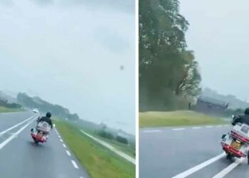 VIDEO: Motorrijder trotseert storm Poly en ontsnapt op het nippertje aan frontale botsing met auto
