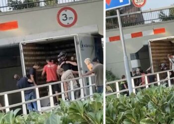 VIDEO: Mannen versus brug: Dé manier om een busje los te krijgen (de politie helpt mee)